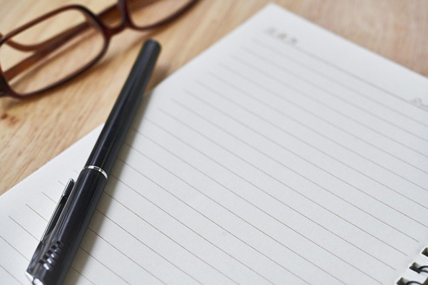 Intro_cropped Spectacles,a pen and a notepad